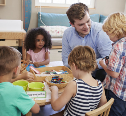 Kids in a Montessori classroom with their teacher